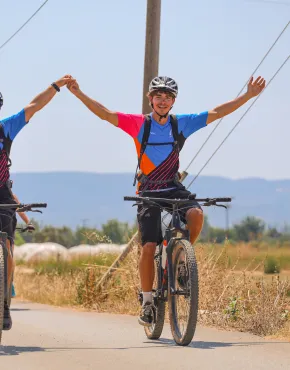 Bike Guides riding MTB's holding hands and smiling